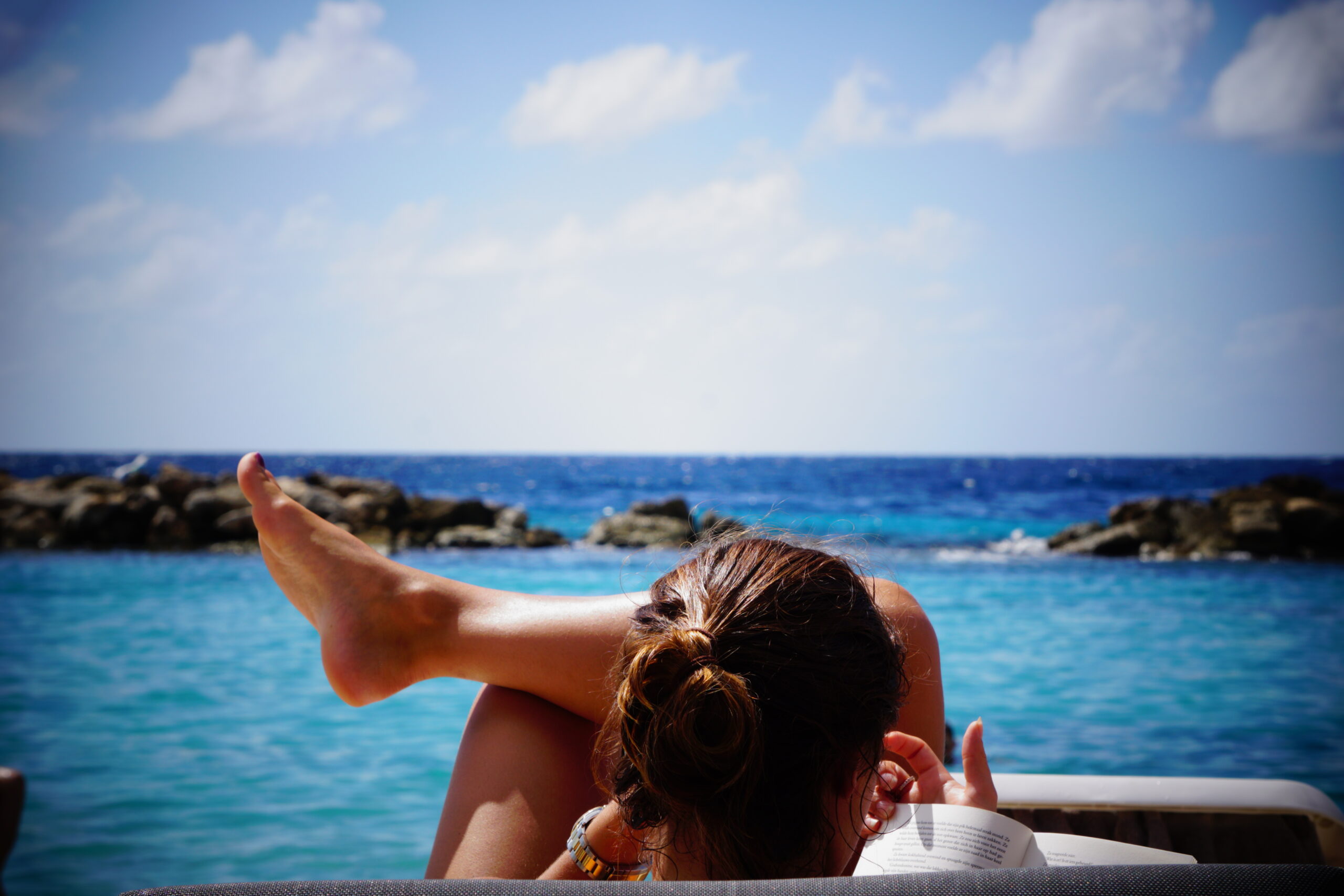 Women relaxing by beach